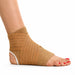 A tan ankle and foot compression bandage wrapped around a person's ankle and foot