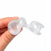 A translucent white silicone nose guard held between a person's fingers